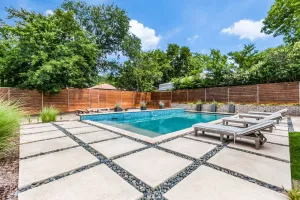 Image of 1\/2 acre with pool, hot tub, playground, cabana, & yard only 15 mins to downtown