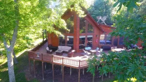 Image of Family friendly log home has great lake views from huge deck!