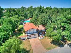 Image of Beautiful home with large outdoor pool and hot tub. Large beautiful backyard