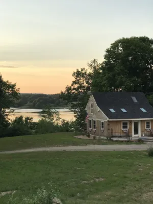 Image of Waterfront cottage with deep water dock, ocean front.