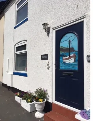Image of Sunbeam Cottage - 3 bedroom traditional cottage - Straight off the beach