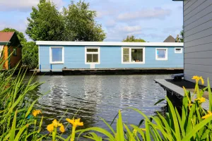 Image of Sunny houseboat near Amsterdam & windmills!