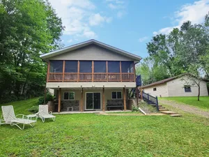 Image of Beautiful Lakefront Home On Large Wooded Lot.