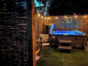 Image of Romantic and luxurious stay with your own private hot tub to enjoy, and luxurious vaulted ceilings.