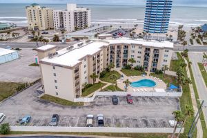 Image of Beach-view condo with pool, balcony, gym & central AC  - walk to the beach