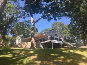 Image of EXCLUSIVE LAKEFRONT with beach, beach house, piers, trampoline + sister villa