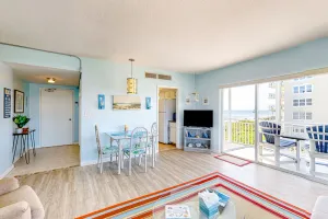 Image of Inviting condo with ocean view, balcony, full kitchen, central AC, & W\/D