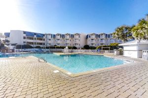 Image of Third-floor courtyard condo with balcony, WiFi, pools, hot tub & putt-putt