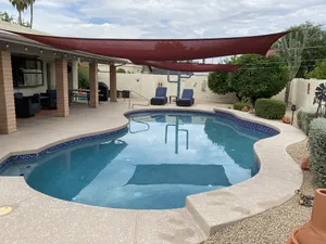 Image of Gorgeous corner lot home with a private pool and hot tub.