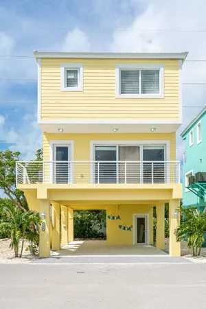 Image of Yellow 3 Story Home
