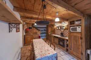 Image of Authentic home, combining the warmth of wood and mountain stone.