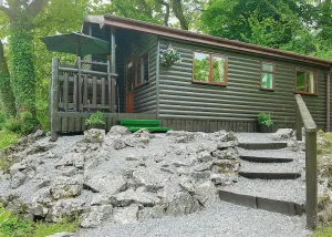 Image of Pine log lodge with one double and one with bunks and a single.