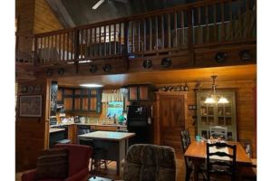 Image of Cabin in the woods overlooking Grenada lake.