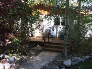 Image of Rare Find! Cozy cottage tucked away, private setting next to creek near downtown
