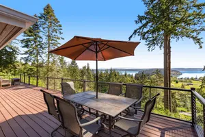 Image of Stunningly situated home with expansive deck & mountain\/water views