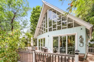Image of Stunning custom home with treehouse setting, deck & neighborhood beach\/boat ramp