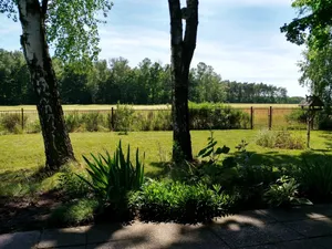 Image of Rural garden house with fireplace and natural panorama