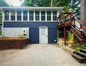 Image of Cozy Blue Cottage With Access To All Sports Lake.