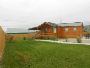 Image of Small House At The Foot Of The Mountains