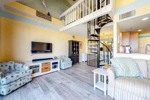 Image of Fun lofted escape near the beach with private balcony, ocean views, WiFi & AC