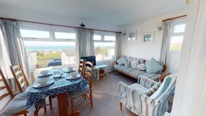 Image of Chy-An-Tewennow is a charming timber beach chalet which offers great sea views