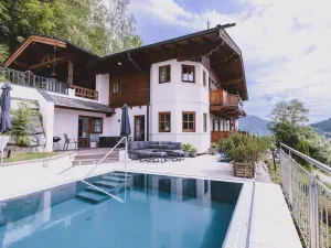 Image of Landhaus Lodges Kaprun - Franz, infinity pool & garden