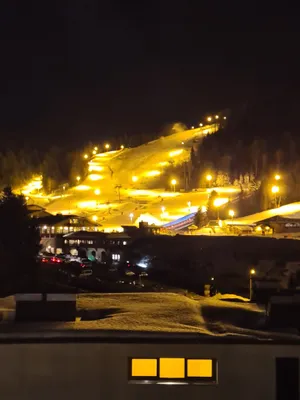 Image of At the foot of the ski resort with a view of the slopes