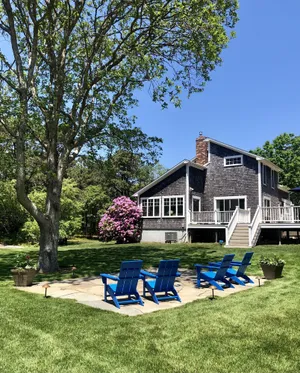 Image of Sunny open house. Lrg Deck. Lndscpd 1 acre lot w stone patio.
