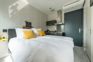 Image of Unique apartment with private kitchen and bathroom, inspired by the abstract art of Lena Milius.