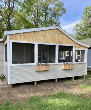 Image of Remodeled lakefront cottage w\/ marina, firepit, swimming area.