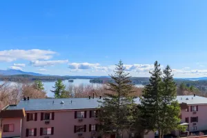 Image of Water view condo with a pool, tennis court, fireplace, balcony & golf nearby