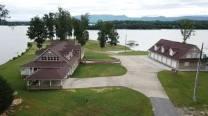 Image of \"LAKE HOUSE\" On 7 Acres Of Douglas Lake With A Private Boat Ramp & Private Dock!