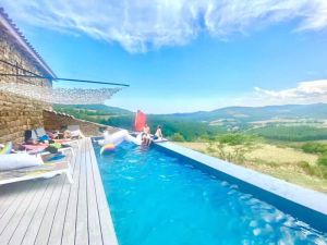 Image of Modern stone farmhouse for groups has Swedish bath infinity pool billiard view