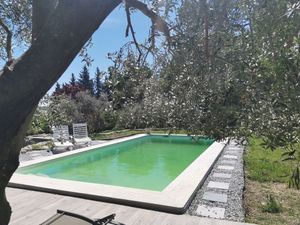 Image of guest house with garden and pool