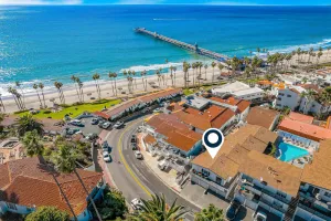 Image of Dreamy dwelling 1 block from the beach, dining & pier with heated pool & balcony