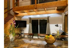 Image of Custom cottage feels bright & airy yet cozy and private in this country setting.