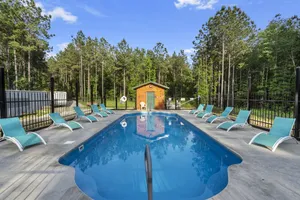 Image of Beautiful cabins with a pool in a peaceful setting