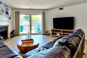 Image of Modern cottage with peek-a-boo side Gulf view & beachfront heated pool & spa