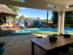 Image of Luxury Resort Home Awaits You! Outdoor Entertaining! Pool, BBQ, Unlimited Wifi