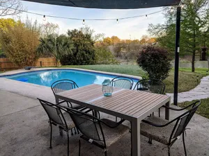 Image of Relax Poolside at a Luxurious Creekfront Home in Round Rock