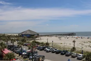 Image of The private covered balcony overlooks the Atlantic Ocean and Tybee Pier.