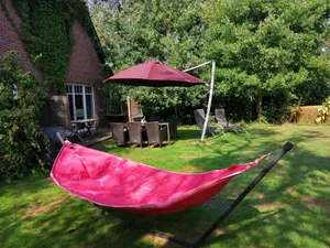 Image of Spacious vacation apartment with fireplace and barrel sauna in the sheltered garden.