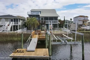 Image of OIB ESCAPE - Canal home steps from beach - DREAM Vacation - 4BR 2BA - Sleeps 17