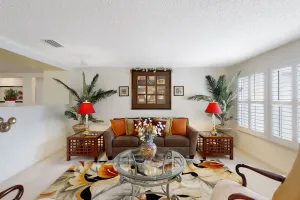 Image of Spacious home with sunroom, patio, fireplace, & water views