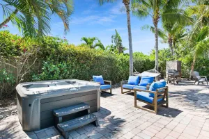 Image of Boca Bliss: Family-Friendly Escape with Hot Tub & Grill, 1 Mile from the Beach!