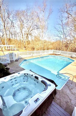 Image of Muletown’s Modern Comfy Cottage w\/ inground pool, hot tub, pool table & fire pit