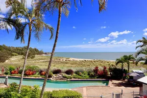 Image of Beachfront and pool views from the balcony _ 5 min walk to the beach.