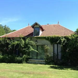 Image of charming cottage at the foot of a 13th century abbey
