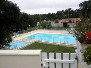 Image of Comfortable villa overlooking swimming pool and tennis court, secure residence
