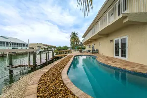 Image of Salty Anglers, Spacious Sombrero Beach Waterfront 4 Bdrm w\/Heated Pool & Dockage